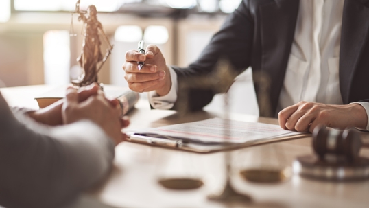 Criminal defense lawyer consulting with a client