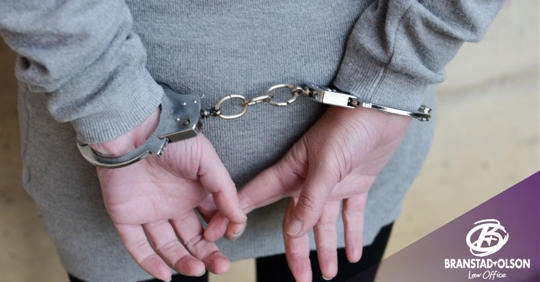Woman in handcuffs behind her back