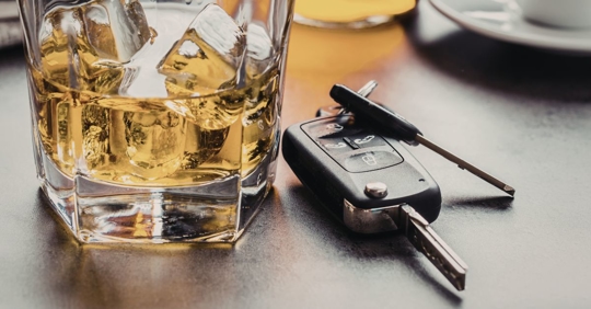 Alcohol and car keys on a table a dangerous combination