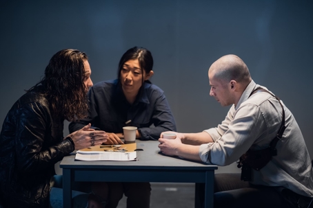 Criminal in jail talking to lawyer